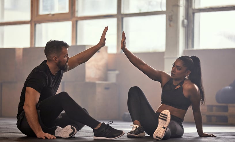 Fit Friends High-Fiving After a Workout